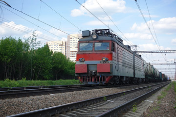 Obraz premium Electric train with a train in Russia. Summer day
