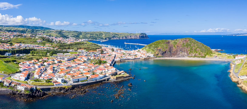 Fort de San Sebastian, idyllic praia (beach) and azure turquoise baia (bay) do Porto Pim, red roofs of historical touristic Horta town centre, Monte (mount) Queimado, Faial island, Azores, Portugal. © Dmitry