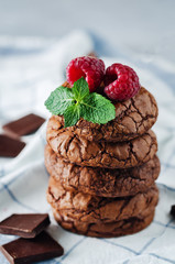 Chocolate brownie cookies with berries and mint leaves