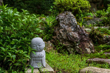 Fototapeta premium statue of buddha in garden