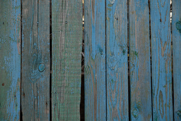 Naklejka premium Textured old painted wooden plank background.