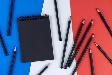 Blacklist France. Mourning, ban, sanctions, politics. black notebook, pencil and a lot of black...