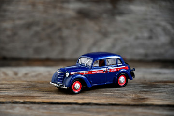 Fototapeta na wymiar Moskvich 400-420 blue 1947 The legendary Soviet car scale 1/43. The collection model of a car of the USSR is a passenger Soviet car of the Moscow plant for the production of small cars (MZMA). Militia