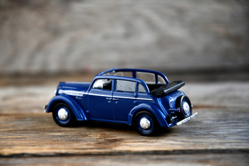 Obraz na płótnie Canvas Moskvich 400-420 blue 1947 The legendary Soviet car scale 1/43. The collection model of a car of the USSR is a passenger Soviet car of the Moscow plant for the production of small cars (MZMA). Cabriol