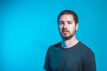 men in front of blue background