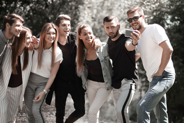 group of happy young men pointing at you.