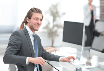 confident businessman sitting at his Desk in the Bank office
