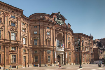 Fototapeta na wymiar Turin, Italy, 27 June 2019: Facade of the Carignano Palace in Turin,
