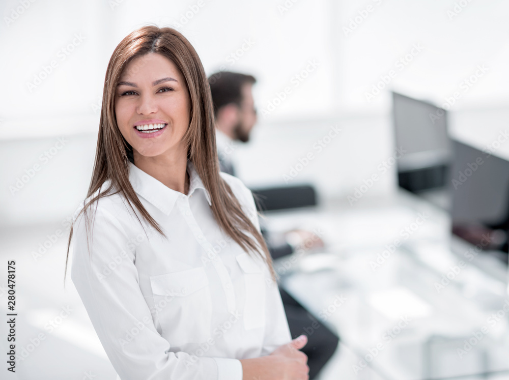 Sticker smiling business woman on the background of the workplace.