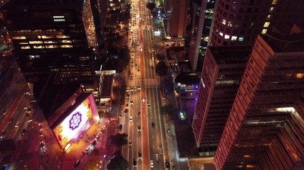 Aerial view of city at night with iluminated avenue. Great landscape.