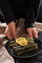 olive oil stuffed leaves on the plate with vegetable for service for restaurant concept from Turkey.