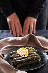 olive oil stuffed leaves on the plate with vegetable for service for restaurant concept from Turkey.