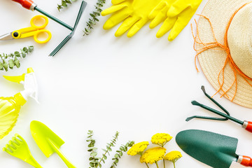 Gardening tools frame on white background top view copyspace