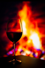 Glass of Wine in front of a fireplace