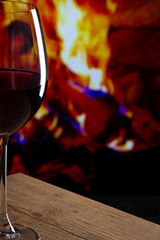 Glass of Wine in front of a fireplace