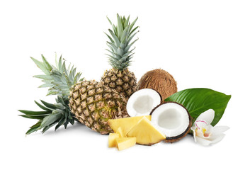Delicious coconuts and ripe juicy pineapples on white background