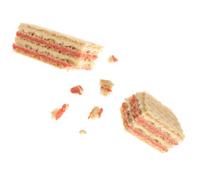 Delicious broken sweet wafer on white background