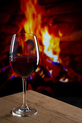 Glass of Wine in front of a fireplace