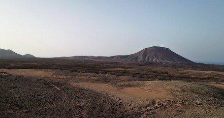 sunset between volcanoes and desert  landscapes and wild nature