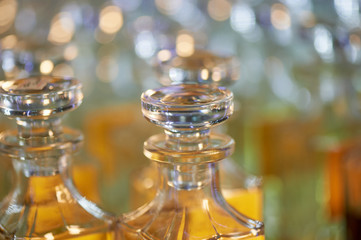 Obraz na płótnie Canvas Glass perfume bottles based oils. A Bazaar, market. Aroma oils, oil perfume in faceted glass vessels.