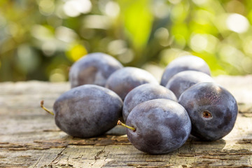 Ripe plums on the table.