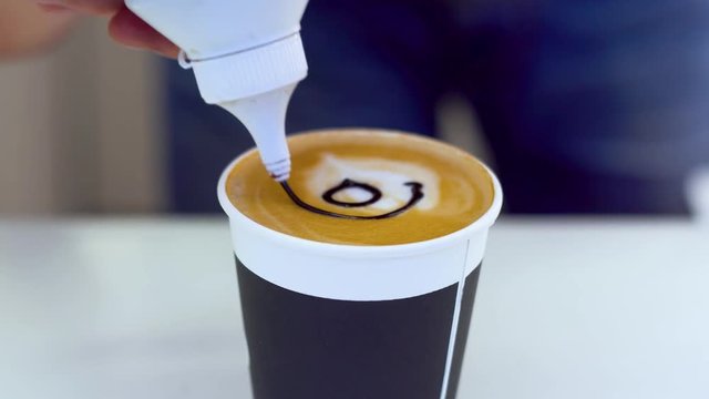 Barista makes a picture of coffee