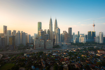 Fototapeta na wymiar Kuala Lumpur city skyline and skyscrapers building during sunrise at business district downtown in Kuala Lumpur, Malaysia. Asia..