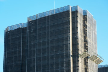 Obraz premium Tokyo,Japan-July 26, 2019: Exterior wall repairing work of an apartment house