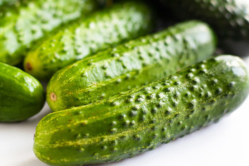 scattered fresh cucumbers , gherkins on the table