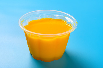 homemade mango flavor pudding on a blue background