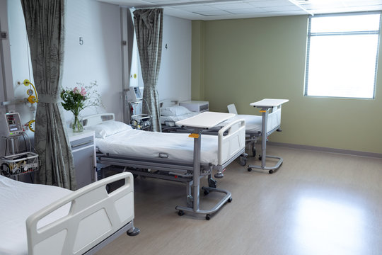 Hospital ward with empty beds