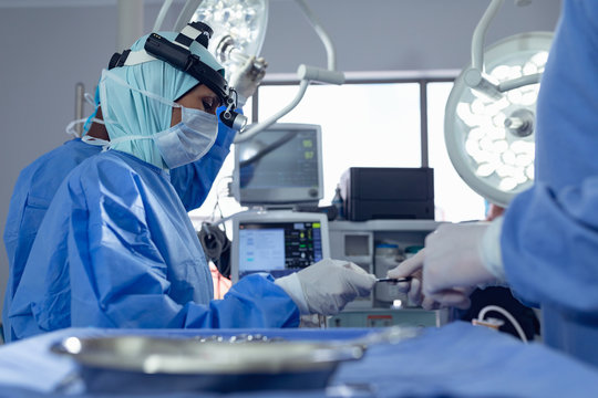 Surgeons performing surgery in operation theater