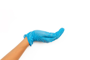 hand in a blue rubber glove holding something isolated on white background