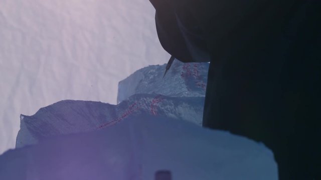 Ics carver chipping ice using hand tools in slow motion