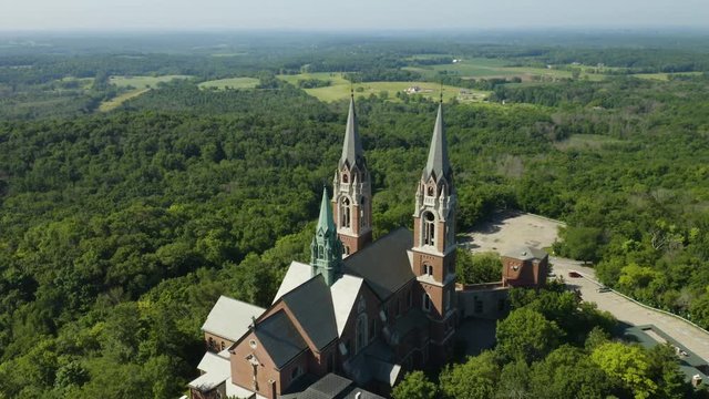 Holy Hill National Shrine of Mary, Wisconsin, USA, aerial view with right to left fligt and tracking of Basilica drone footage.