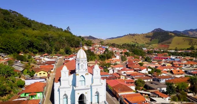 Panoramic view of the city of 'Sao Bento do Sapucai' in the state of Sao Paulo. Sao Bento Church Drone camera movement zoomed out