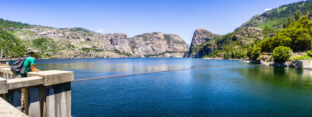 Hetch Hetchy reservoir on a sunny summer day; Wapama and Tueeulala Falls visible in on the far side...