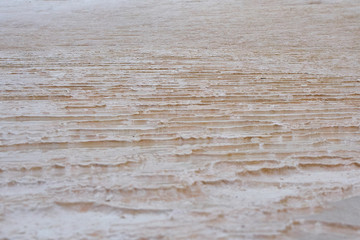 Undulatory texture of white calcite stalactites covering a cascade of terraced baths in Pamukkale, Turkey. Included in the UNESCO list of natural heritage.