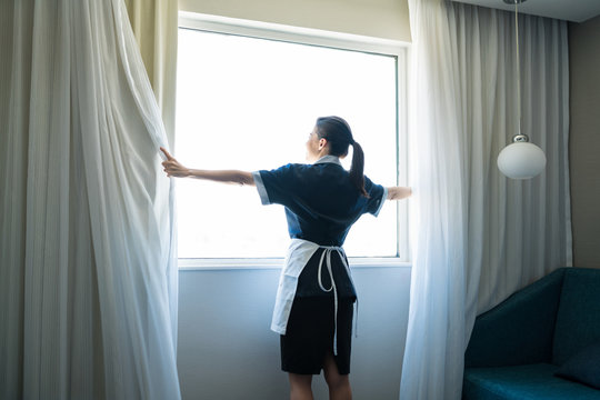 Mid Adult Attendant Working In Hotel Room