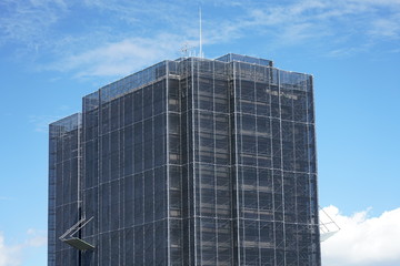 Obraz premium Tokyo,Japan-July 26, 2019: Exterior wall repairing work of an apartment house