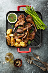 Grilled lamb chops with green herb sauce, asparagus and potatoes