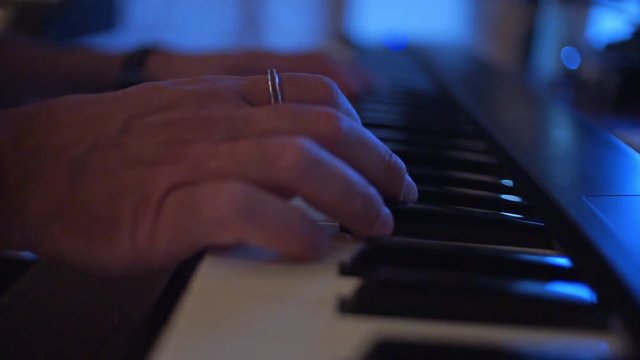 CLOSEUP Hands of a musician playing a piano