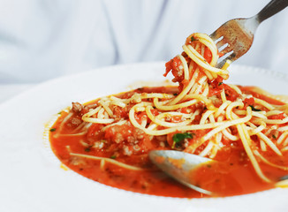 fork with spaghetti meat sauce
