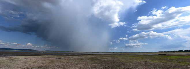 small raining over drying lake