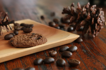 cinnamon sticks and coffee beans on wooden table