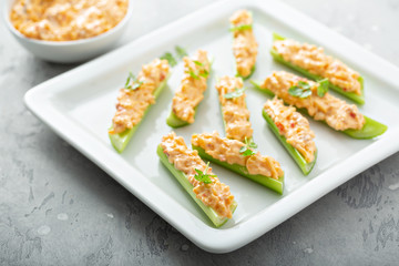 Celery sticks or boats with pimento cheese and cilantro