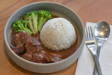 Beef stewed in soy sauce with rice. Cooked beef meat in asian style.