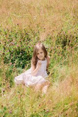 Fototapeta na wymiar Girl in the grass