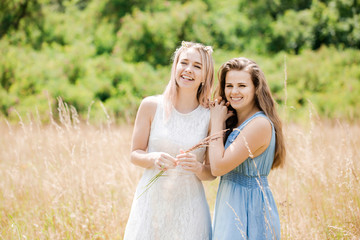 Fototapeta premium Two beautiful cheerful girls