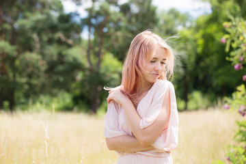 Fototapeta na wymiar woman with pink hair in a pink costume